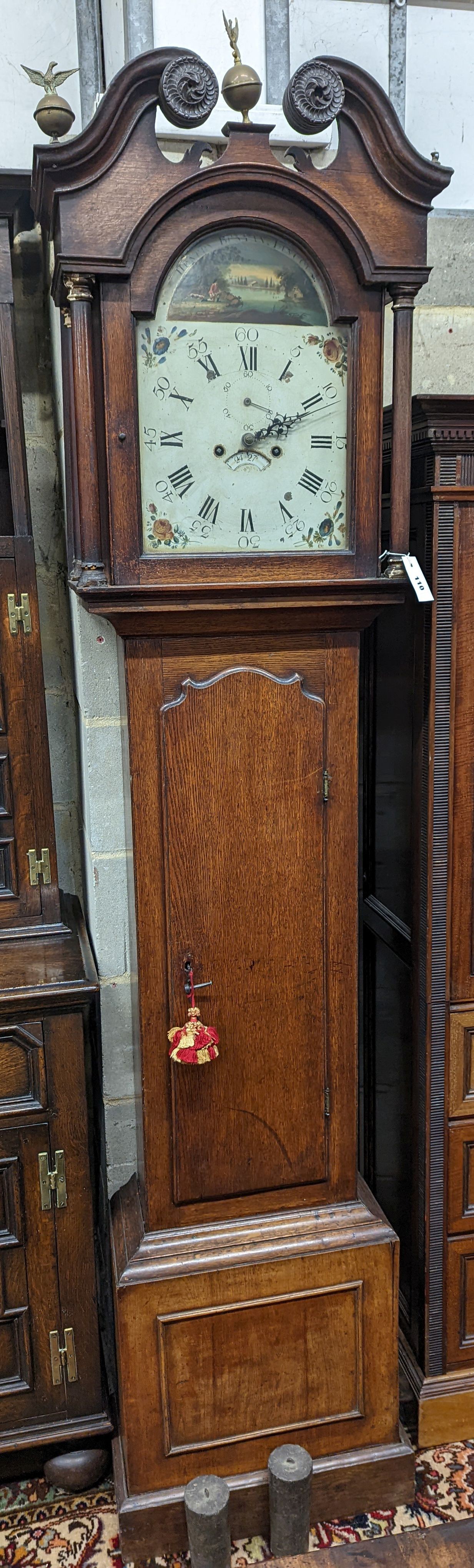 An early 19th century oak eight day longcase clock, the painted dial marked Henry Bunyan, Lincoln, (case in two sections) height 224cm